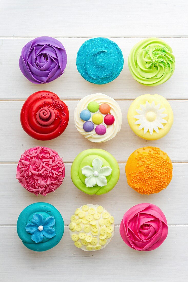 Colorful cupcakes against a white background