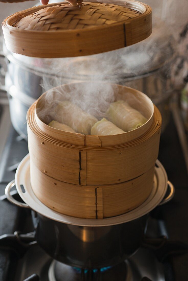 Chinese cabbage rolls in a steaming basket