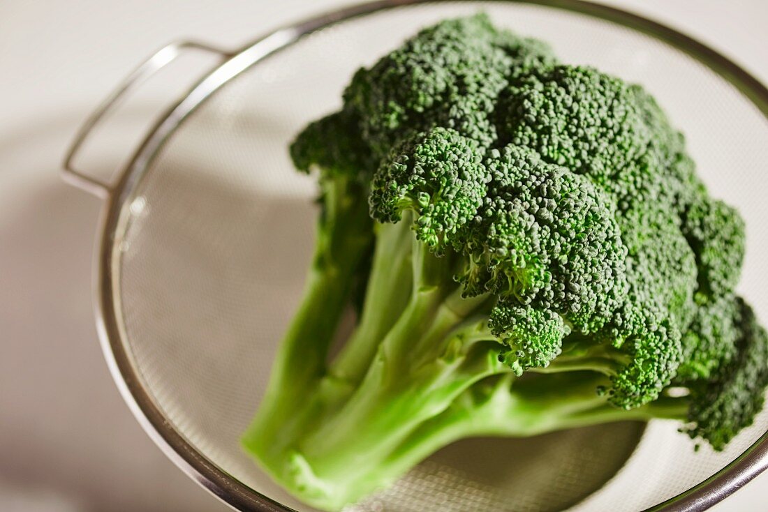 Fresh broccoli in a glass bowl