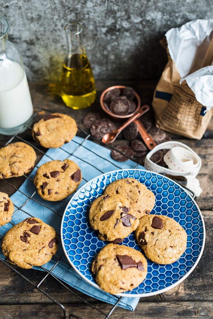 Chocolate chip cookies made with olive oil on a blue plate