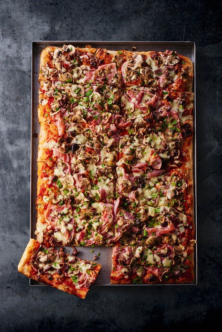 Pizza picante on a baking tray