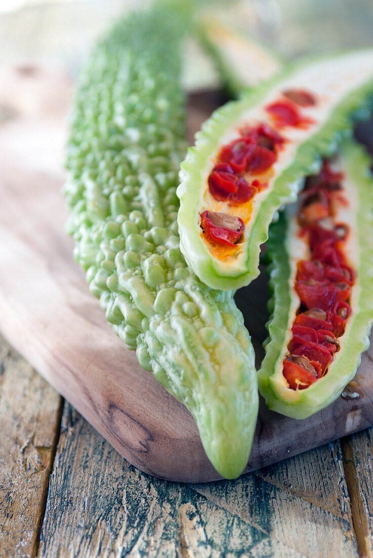 Bitter gourds on a chopping board