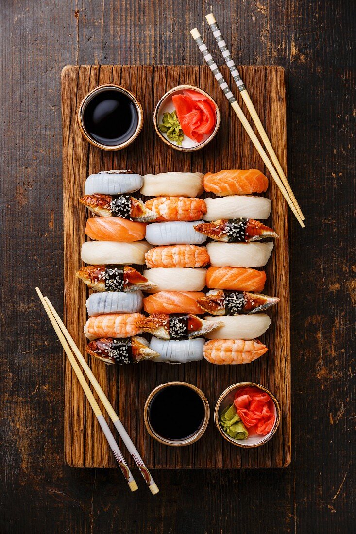 Nigiri sushi set for two on wooden serving board block