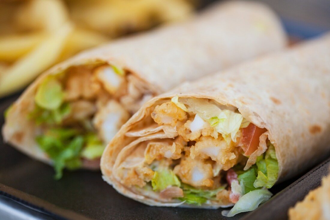 Two wraps with fried calamari and lettuce