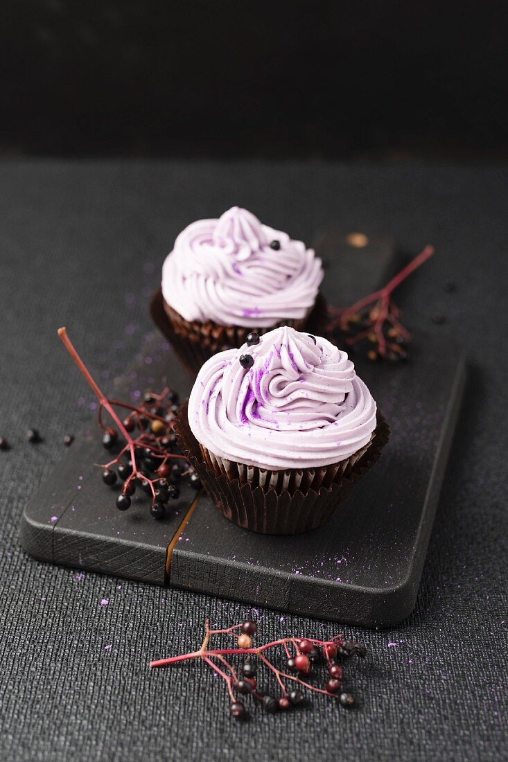 Cupcakes with an elderberry cream topping
