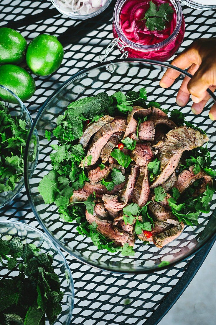 A large bowl of Thai Grilled Beef and Herb Salad