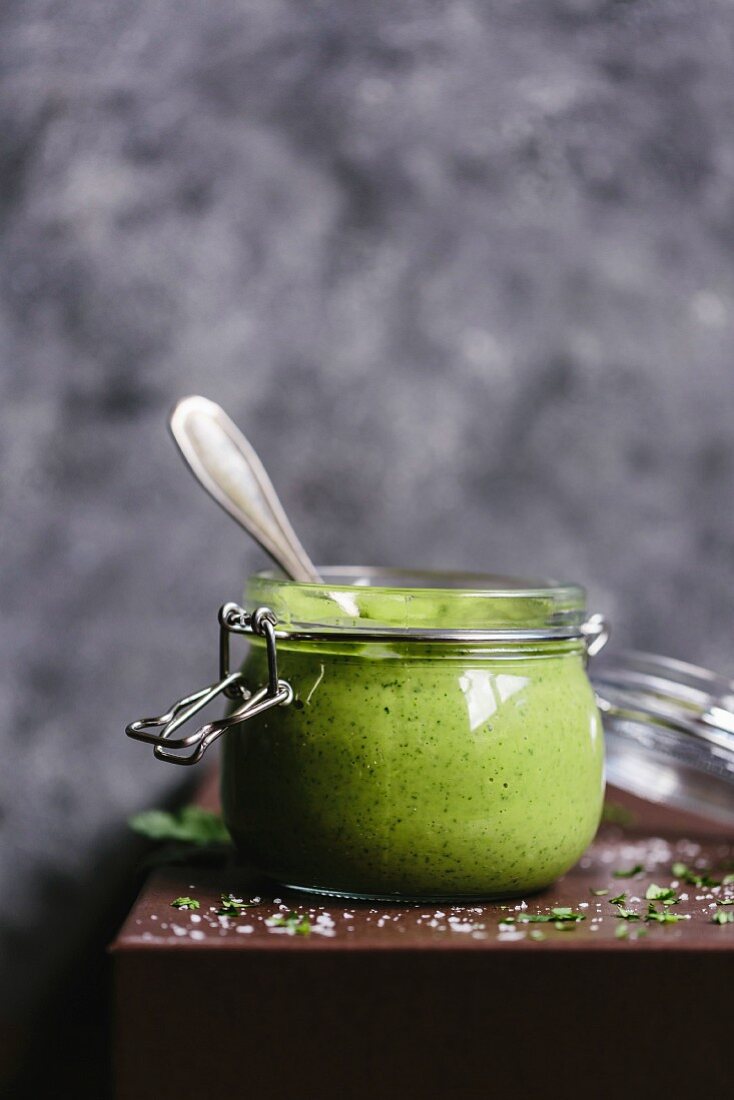 A jar of creamy avocado salad dressing