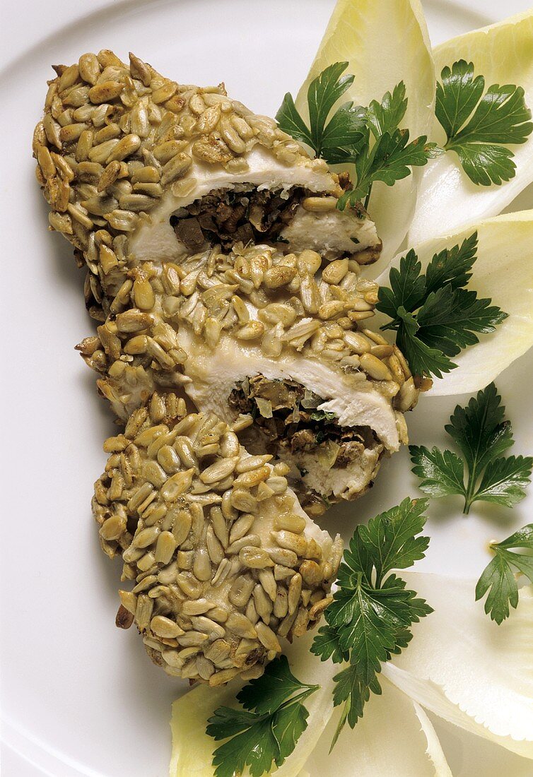 Mushroom stuffed chicken breast coated with sunflower seeds