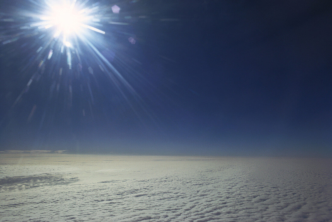 Sun with Cumulus and Stratus Clouds