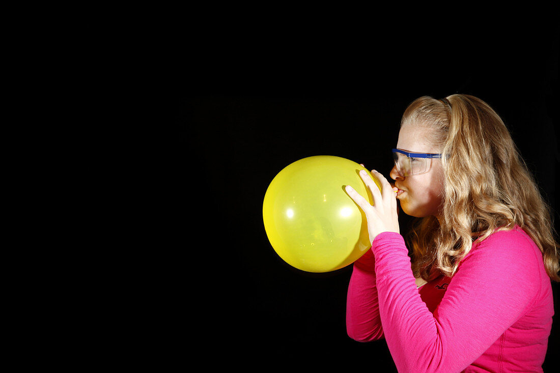 Girl Inflating Balloon