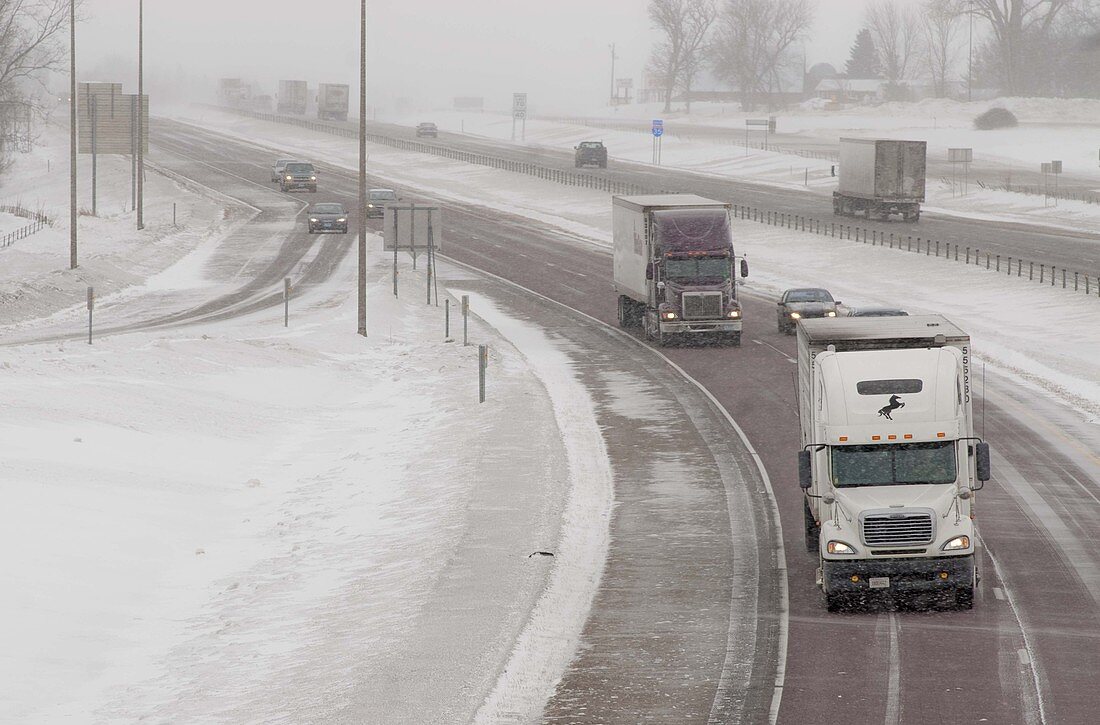 Trucks in snowstorm,USA
