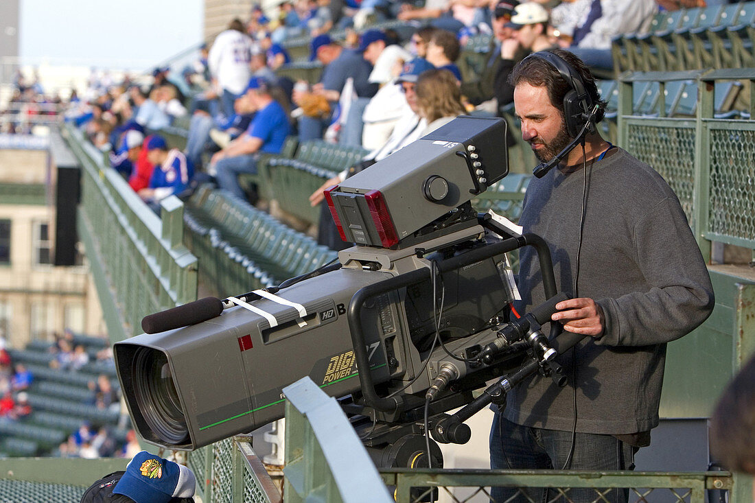 Cameraman at a Baseball Game,USA