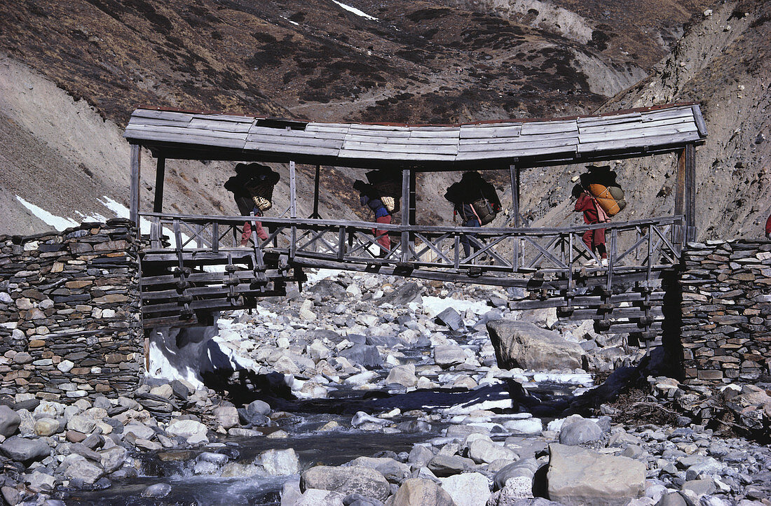 Four Porters Travel Across Bridge,Nepal