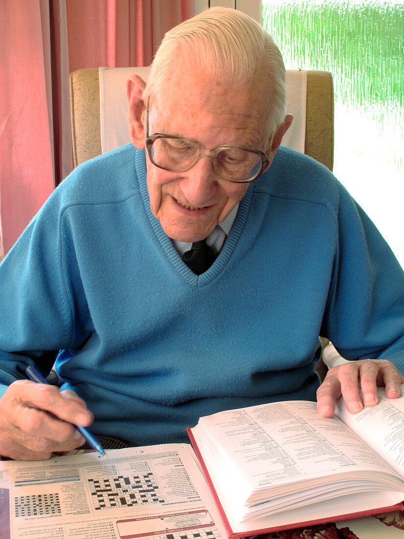Elderly Man Doing Crossword