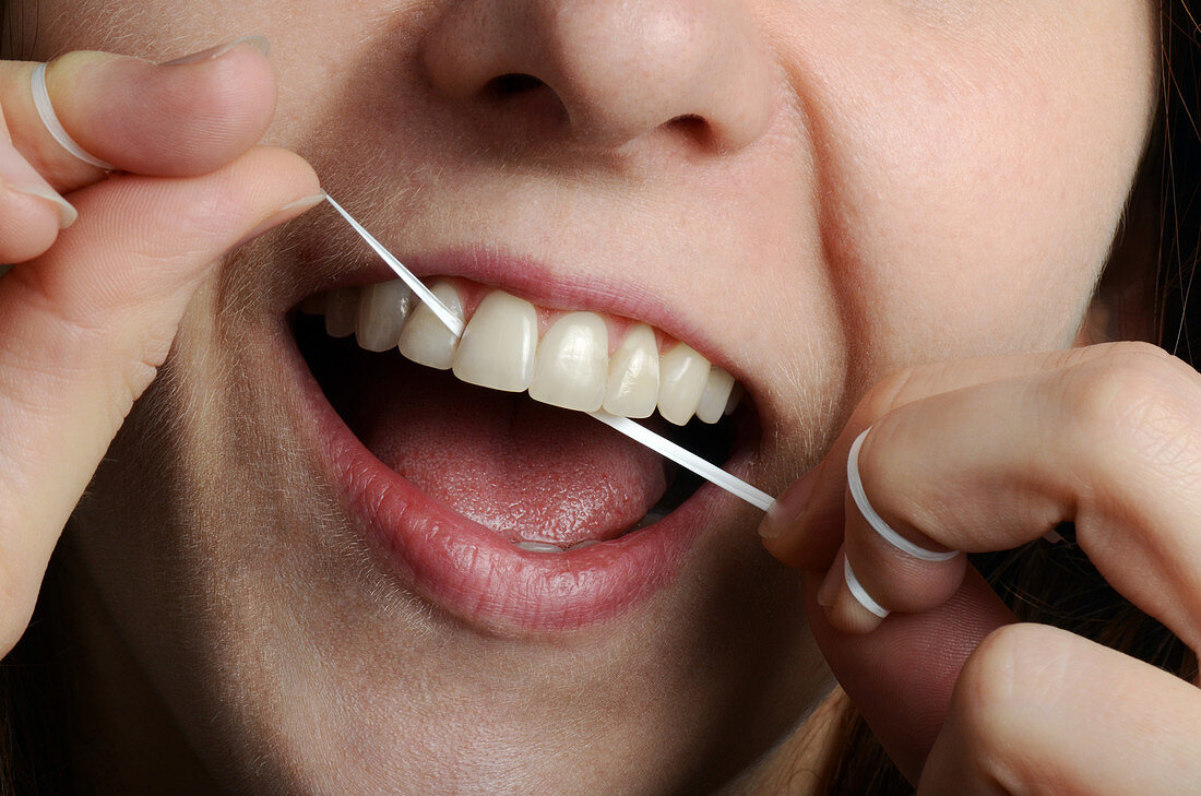 Woman Flossing her Teeth
