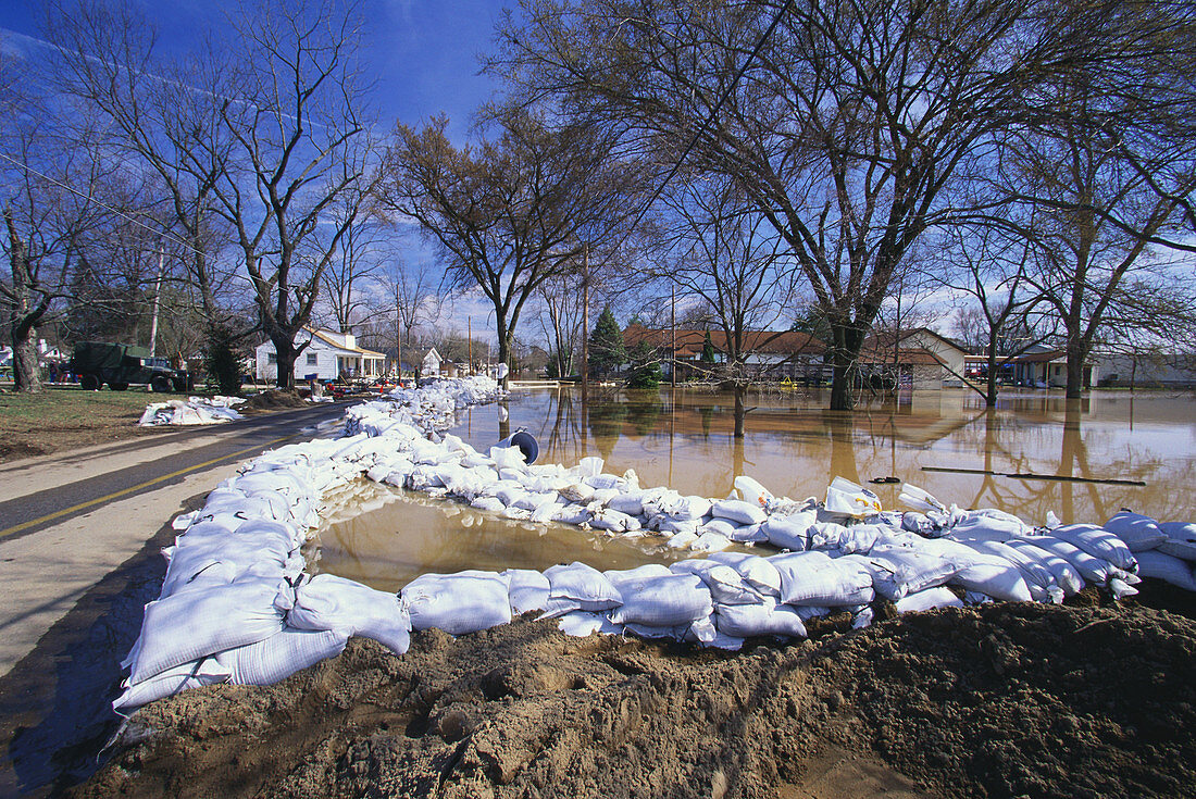 Sandbags holding flooded Ohio River