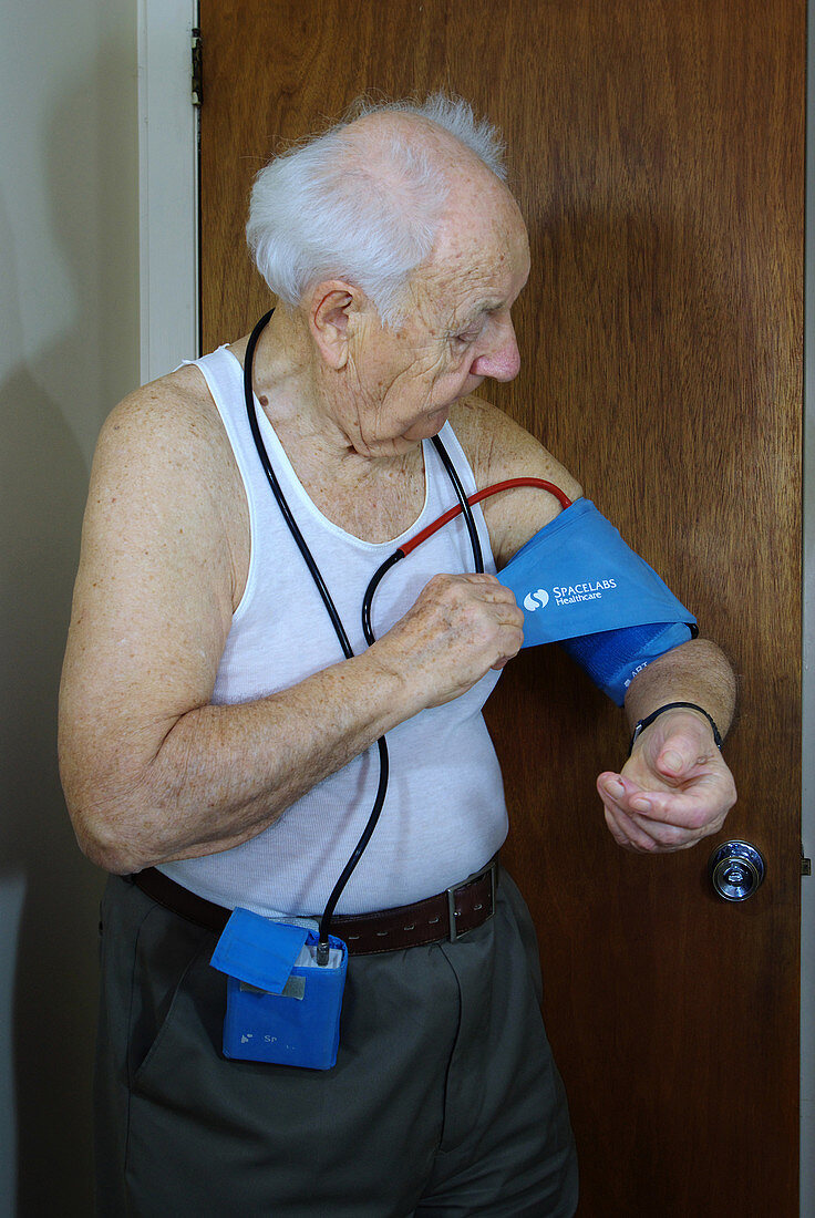 Man Wearing a Blood Pressure Monitor