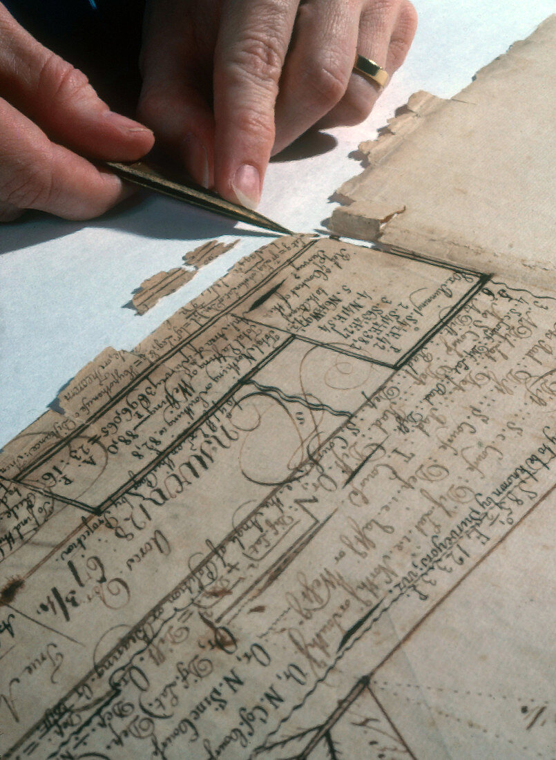 Conservator Does Repair Work on Document
