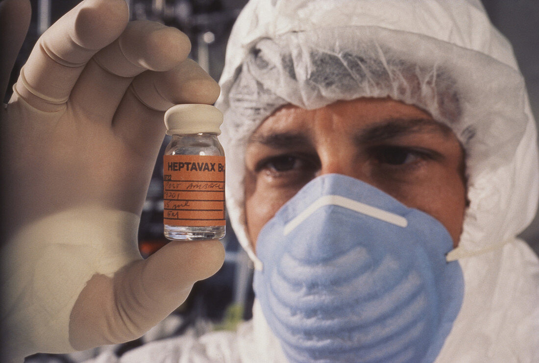 Researcher holds vial of rDNA Hepatitis B