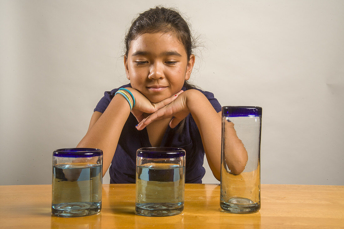 Girl in a Liquid Conservation Experiment