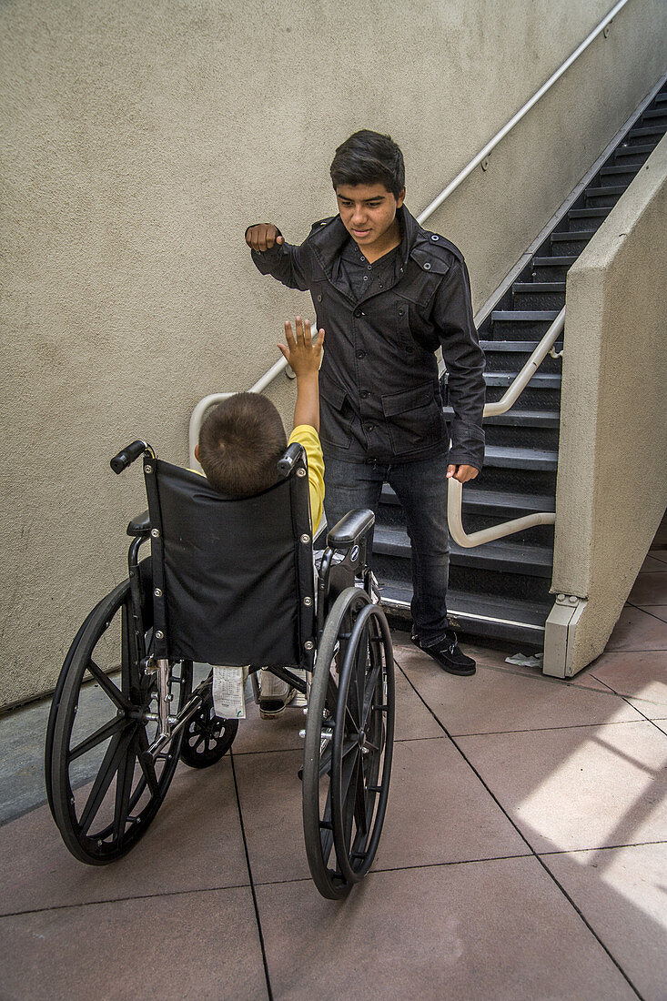 Bully Threatening Boy in a Wheelchair