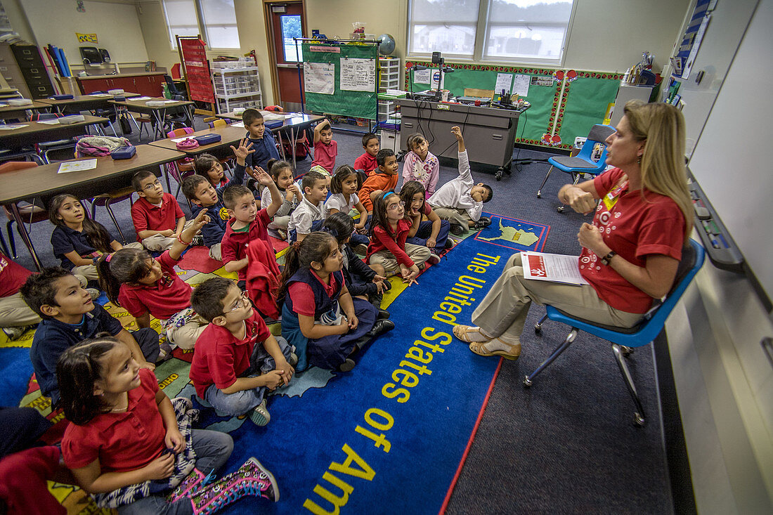Volunteer Teacher Reading to Children