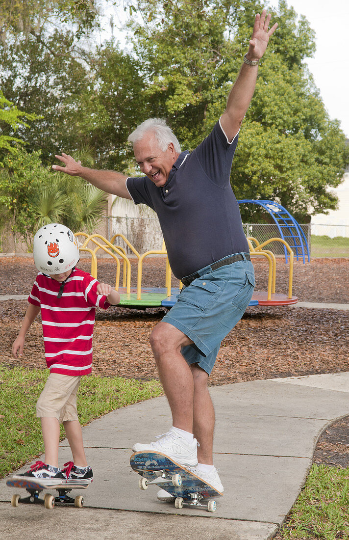 Grandfather and Grandchild Skateboarding