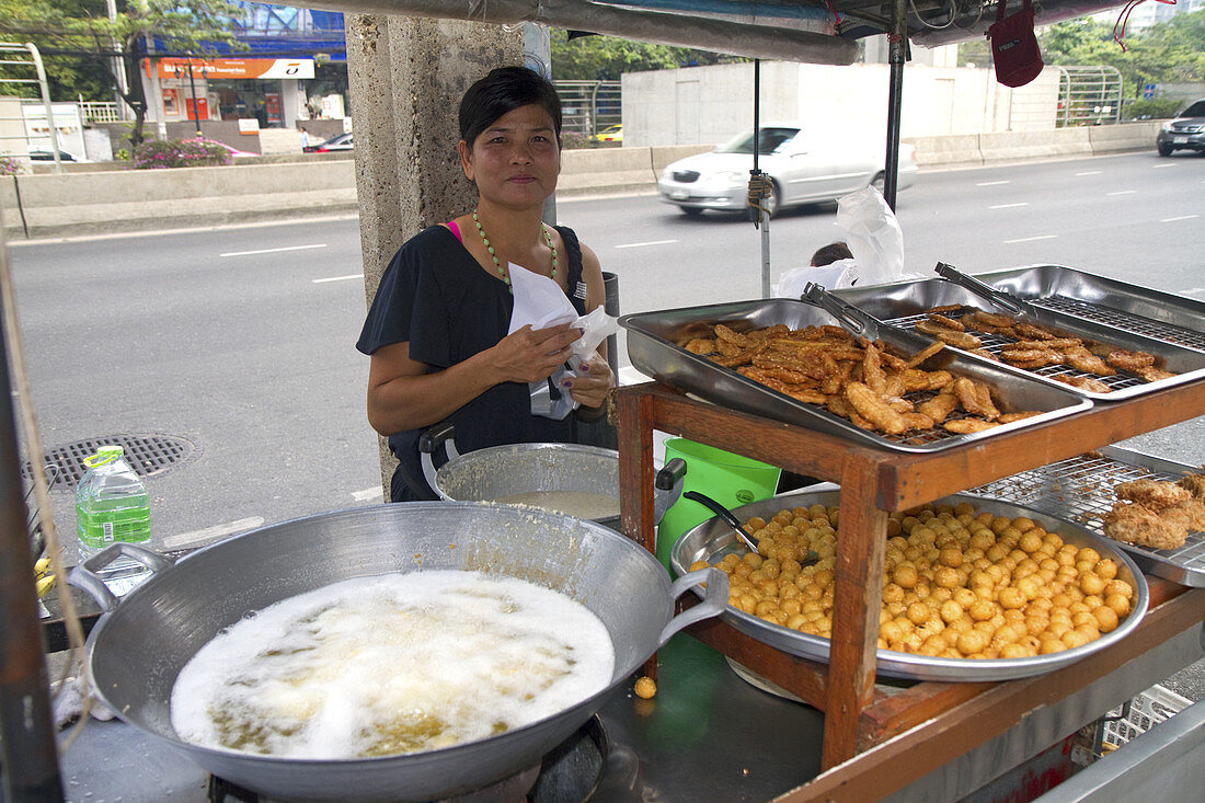 Street Vendor Using a Wok,Thailand