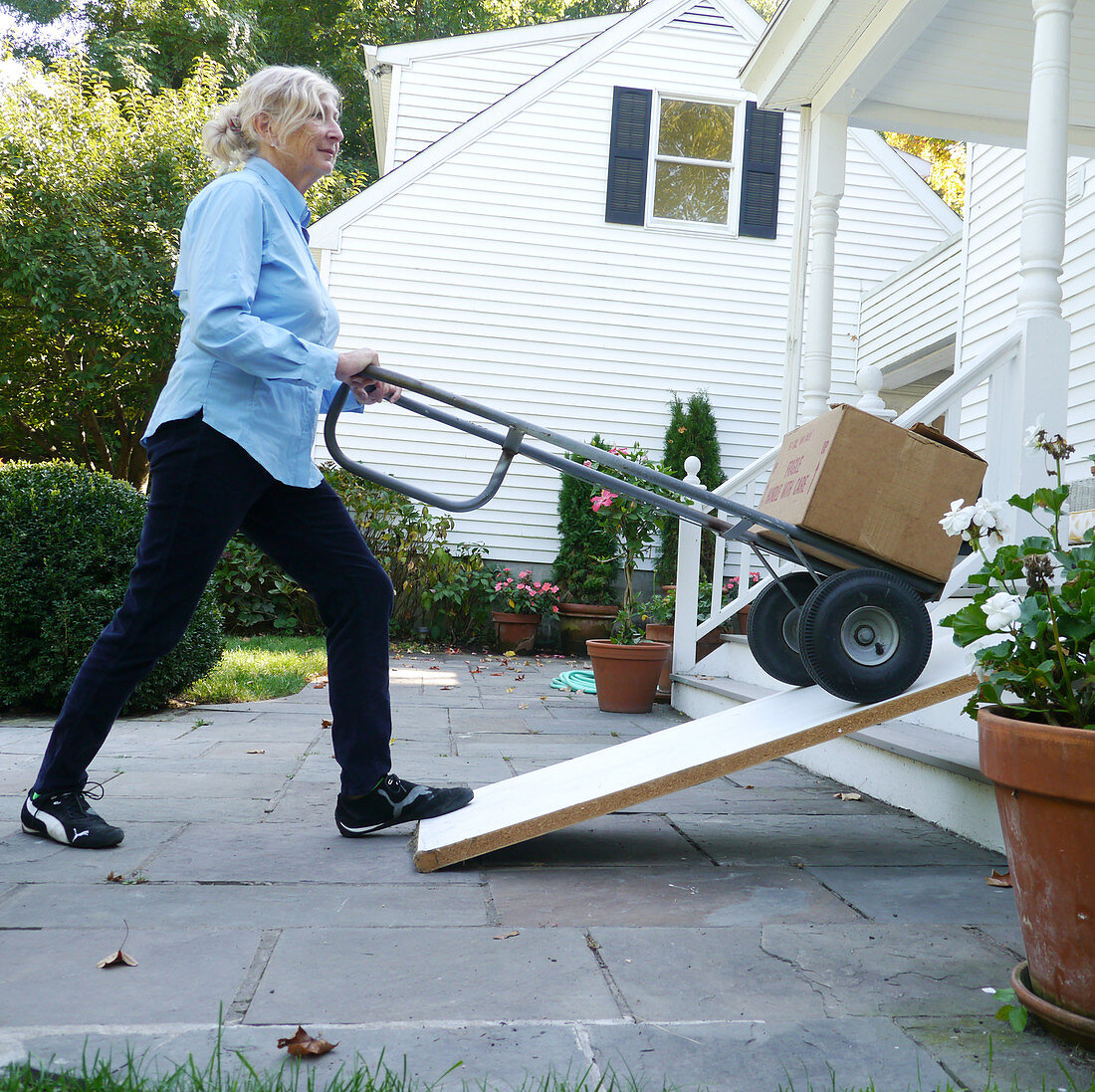 Senior Woman Moving Boxes