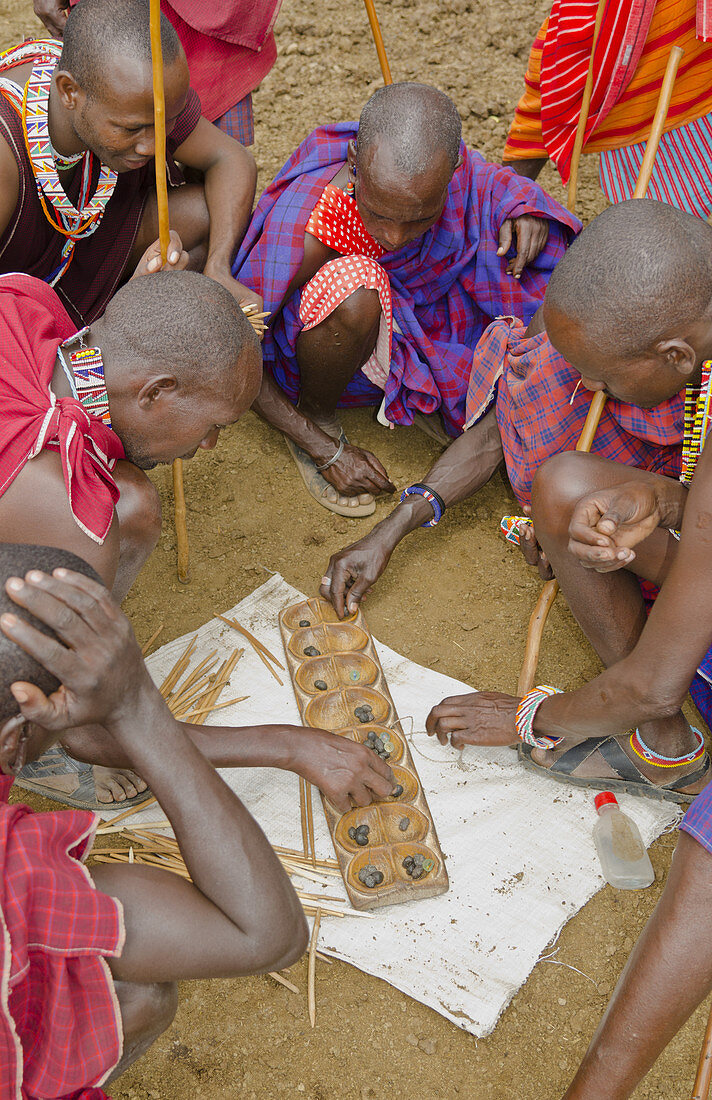 Masai Men Playing Bao Game in Village