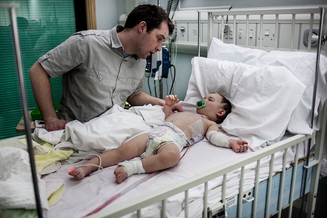 Father with baby son with pneumonia