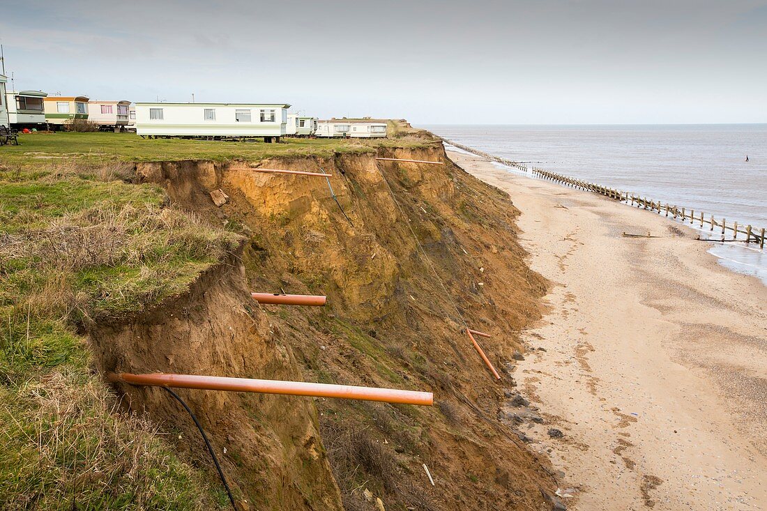 Eroded coast revealing drainage pipes