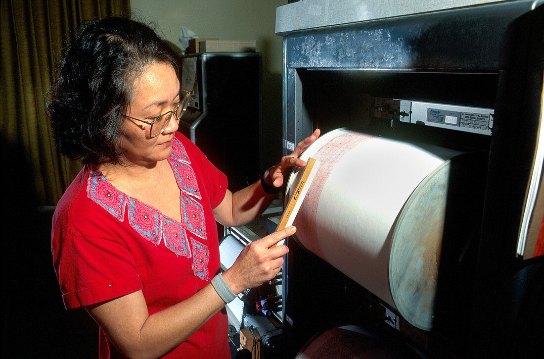 Researcher using a seismograph