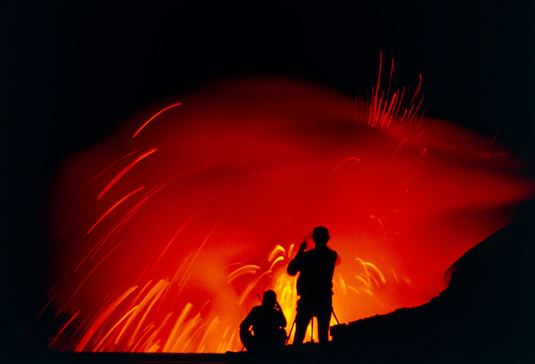 People observing Kilauea lava flowing into ocean