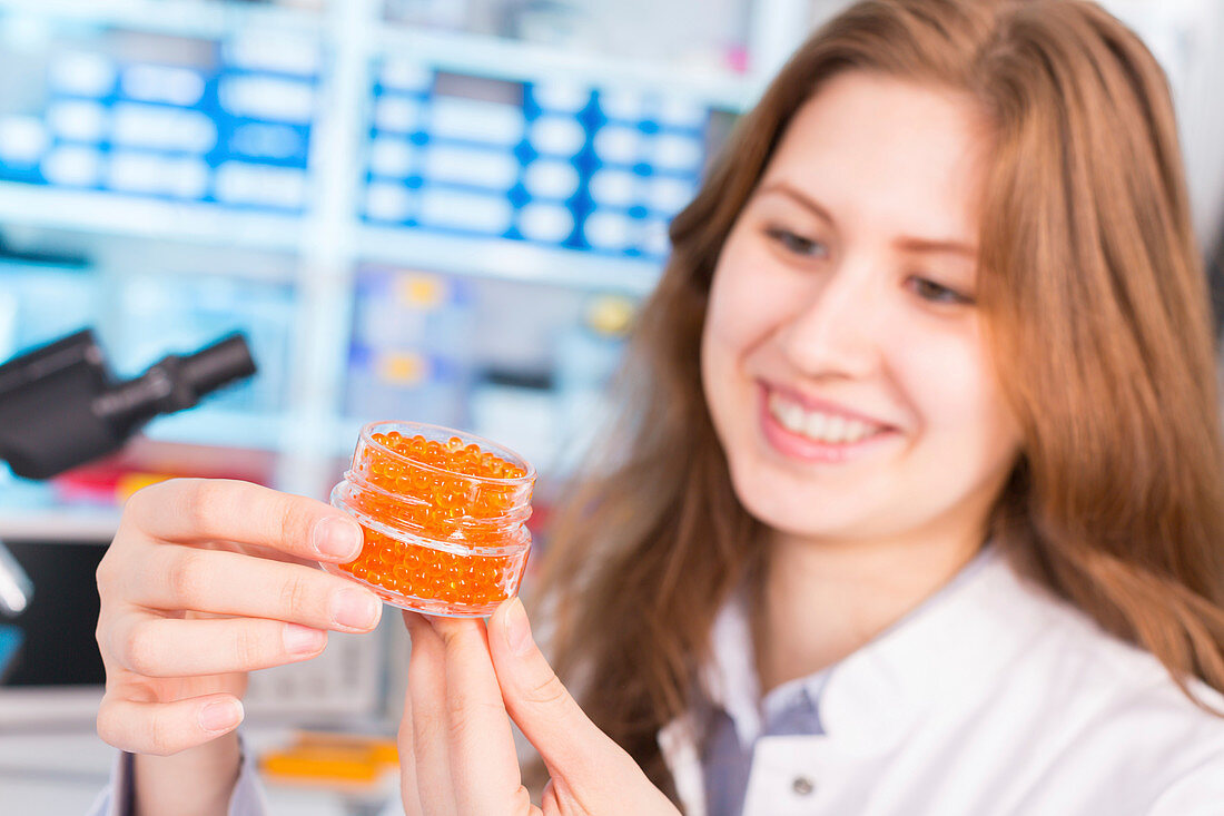 Lab technician testing caviar in lab