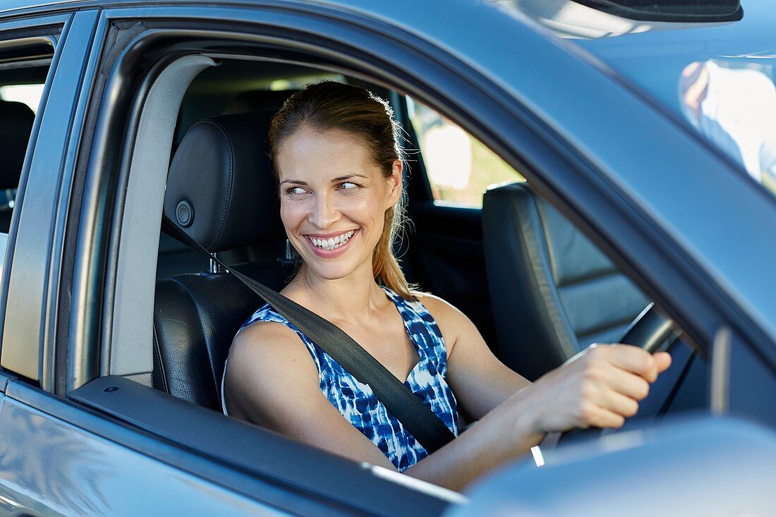 Woman looking through car window