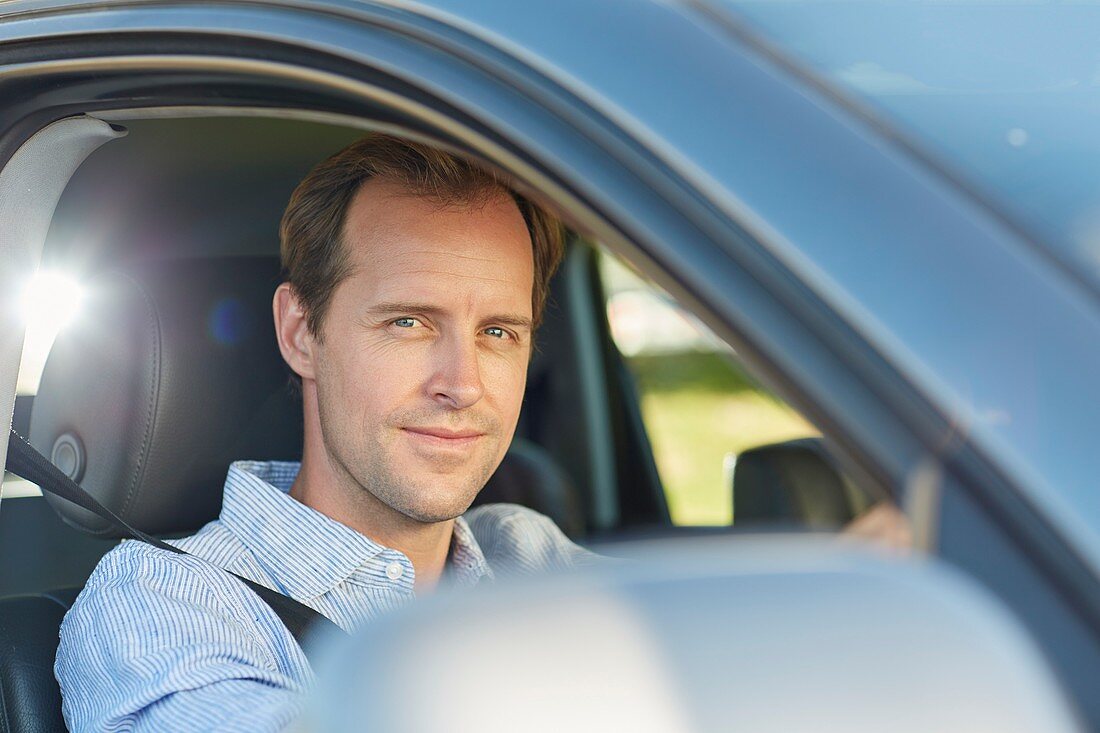 Mid adult man in car