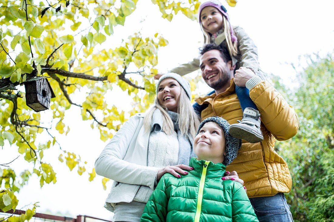 Family in park smiling together