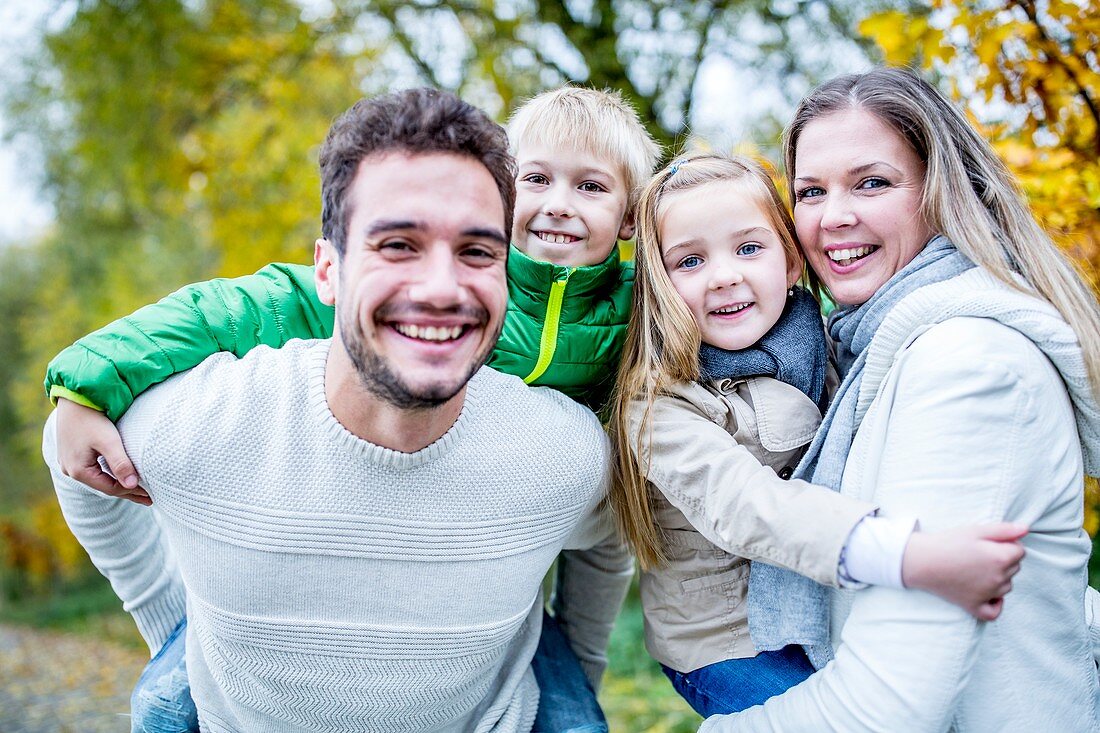 Portrait of family enjoying in autumn