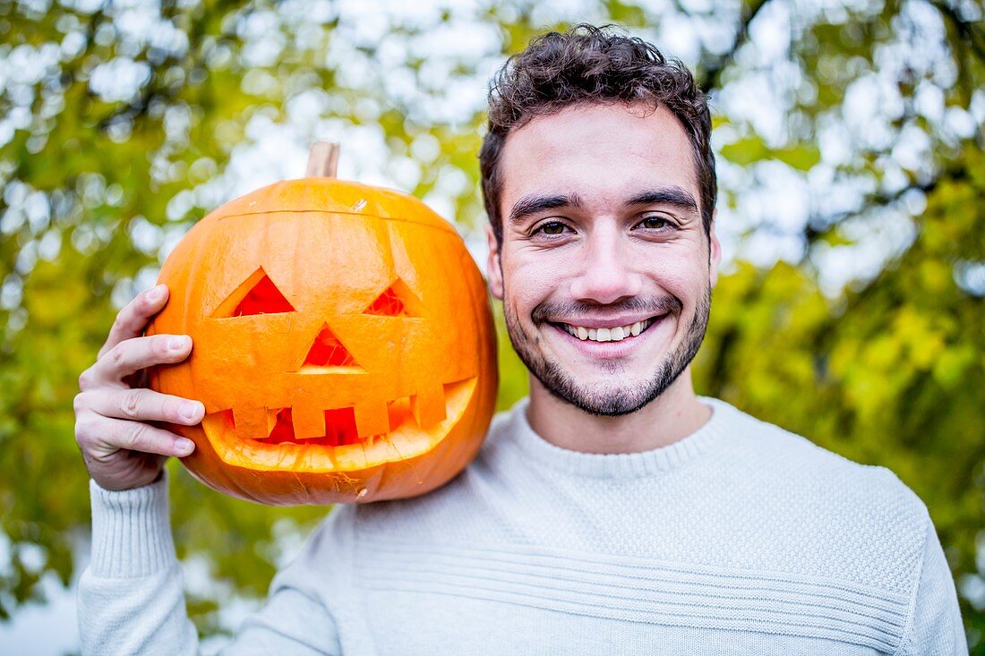Man with Halloween pumpkin