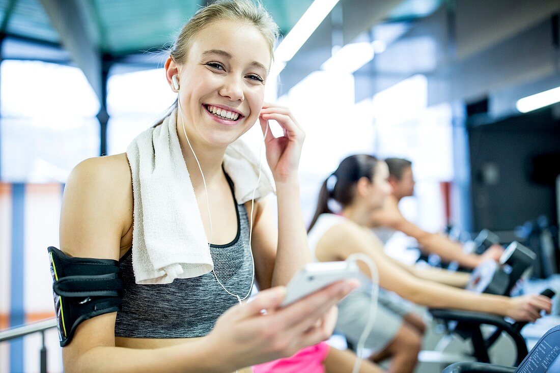 Woman adjusting headphones