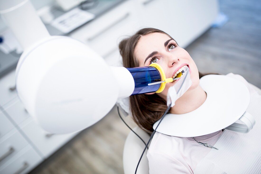 Young woman having dental x-ray