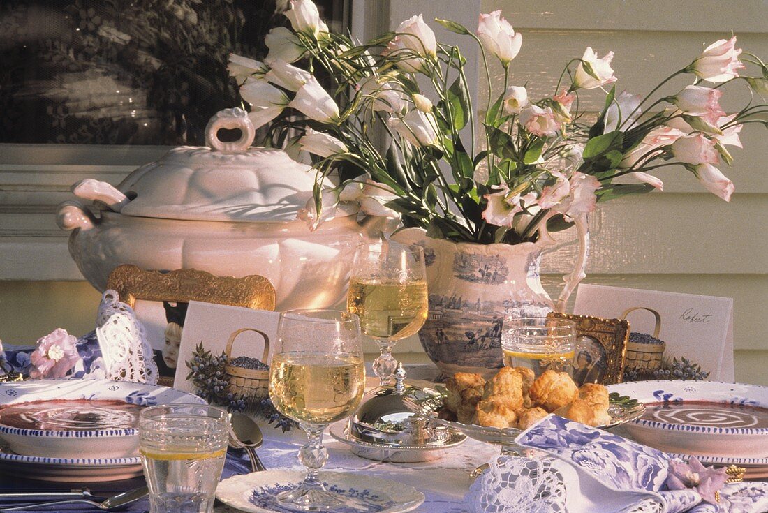 Outdoor Summer Table Setting with Soup and Flowers