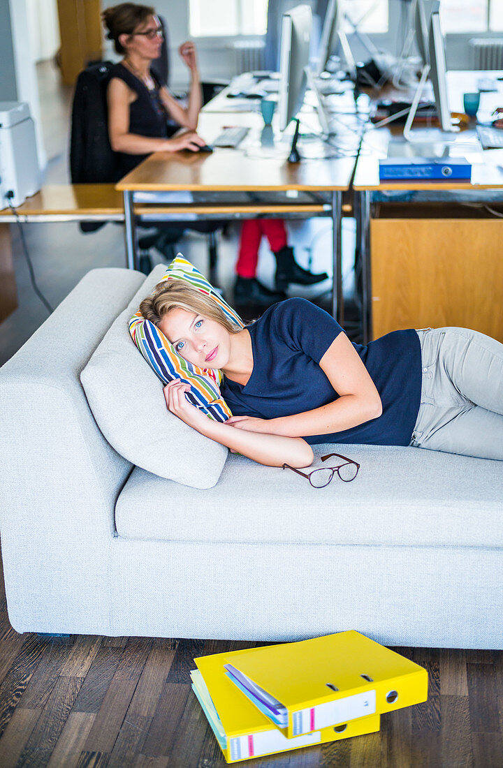 Woman taking a nap in the office