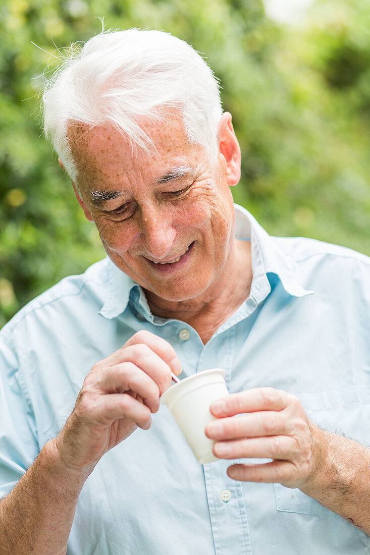 Man eating yogurt