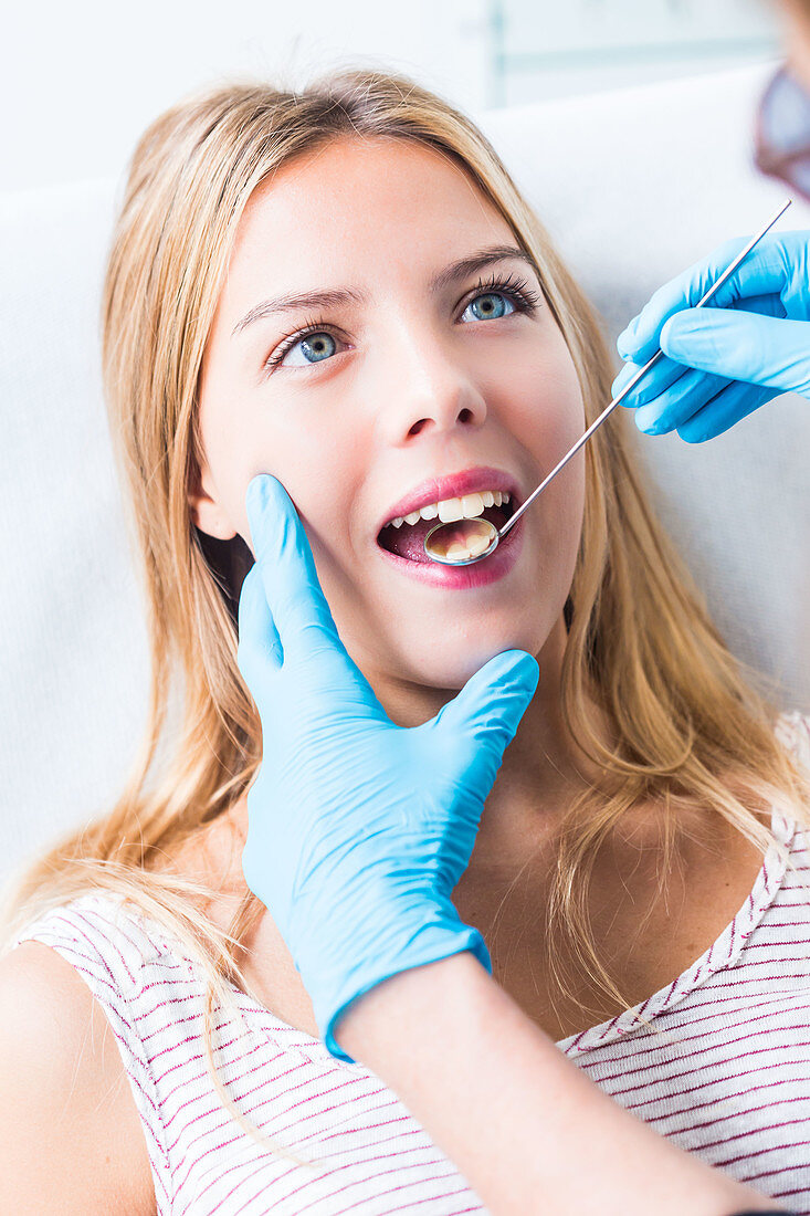 Woman getting dental examination at the dentist
