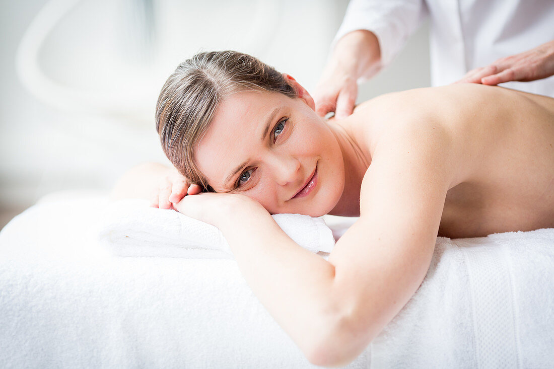 Woman receiving a back massage