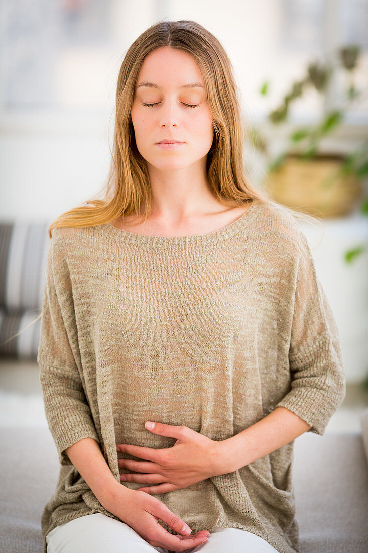 Woman doing breathing exercises