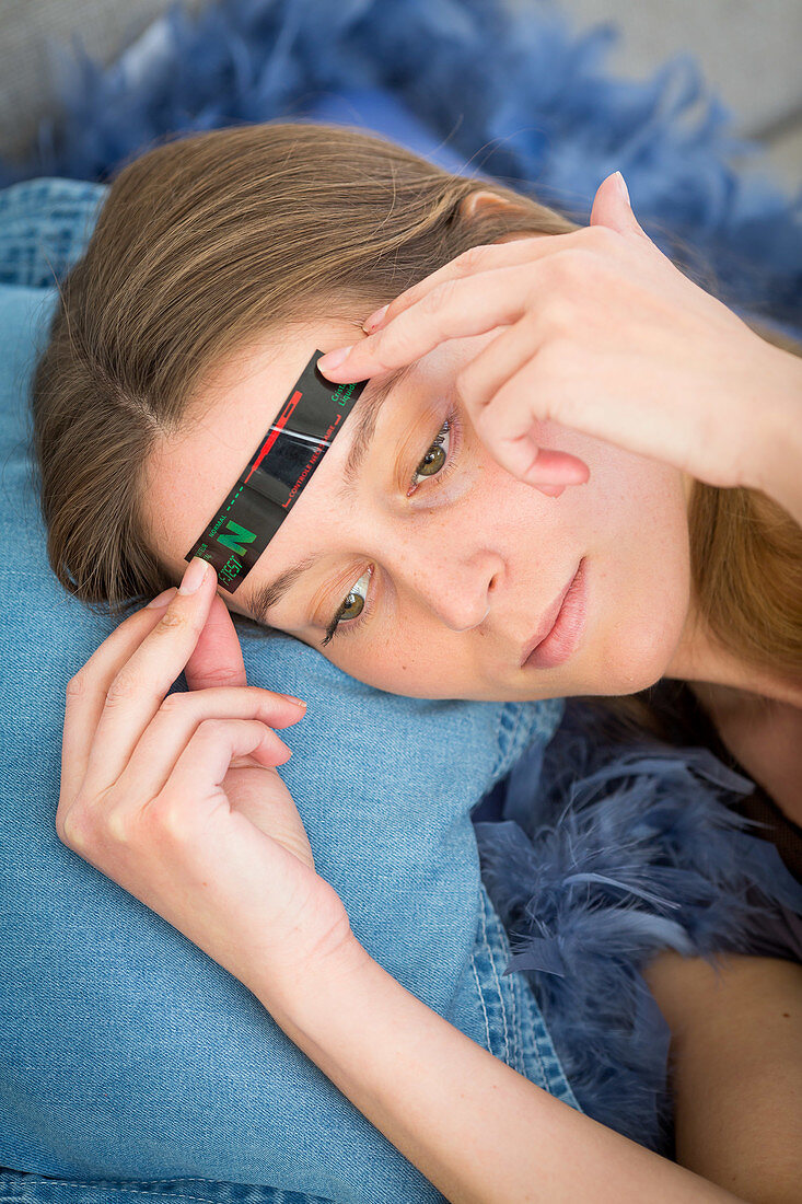 Woman checking her temperature