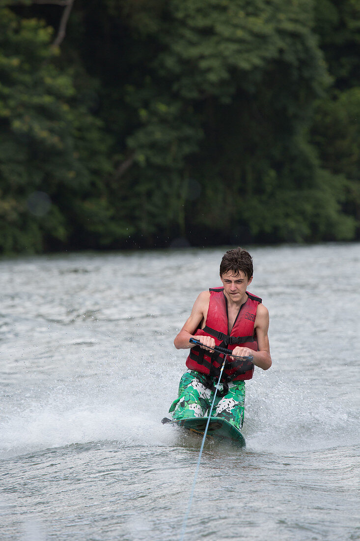 Teenager waterskiing